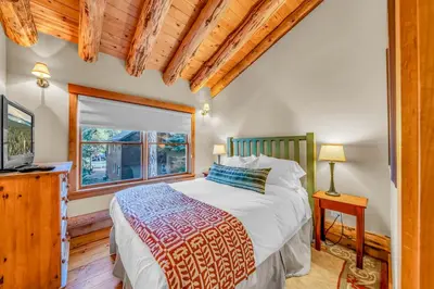 a bedroom with a bed and a window at Lake Tahoe Haven Private Hot Tub Deck in Tahoma