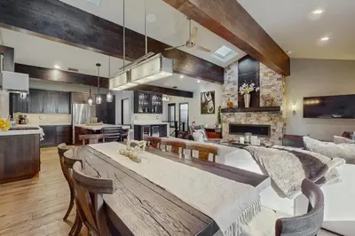 a kitchen and living room with a table and chairs at Lakeshore Luxe in Incline Village