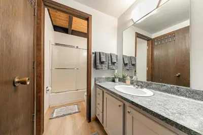 a bathroom with a sink and a mirror at Kingswood Pines in Kings Beach