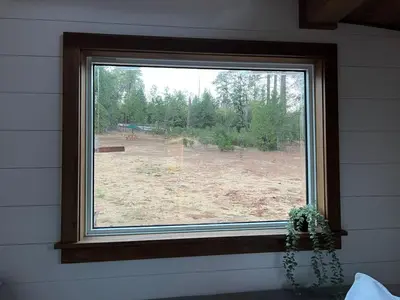 a window in a room with a view of a field at Tiny Rustic at Yosemite Gateway in Groveland