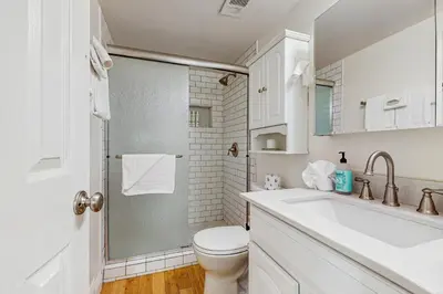 a bathroom with a shower and a toilet and a sink at The Treetop Retreat in Incline Village