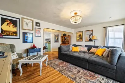 a living room with a couch and a table at Vintage Vine House in Murphys