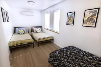 a room with two beds and a window at Boat Dock - Lake Front - Dog Friendly - Sleeps 7 in Bass Lake