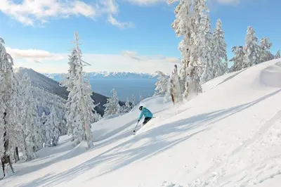 a person is skiing down a snow covered slope at Fireside at Tahoe City in Tahoe City