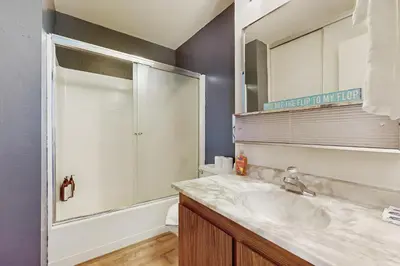 a bathroom with a sink and a mirror and a toilet at Fireside at Tahoe City in Tahoe City