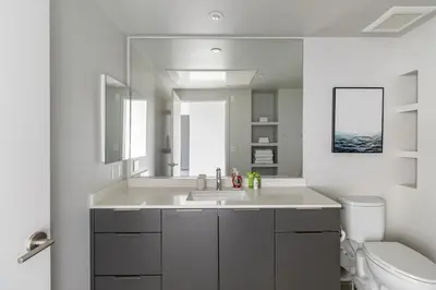 a white bathroom with a sink and a toilet at Landing Modern 1BD Clubhouse Courtyard in Reno