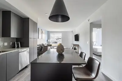 a kitchen with a table and chairs in a room at Landing Modern 1BD Clubhouse Courtyard in Reno