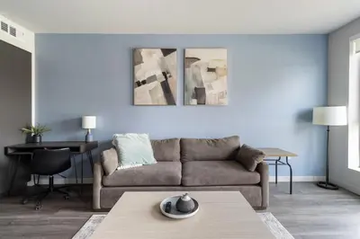 a living room with a couch and a table at Landing Modern 1BD Clubhouse Courtyard in Reno