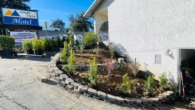 a garden in front of a building at Rodeway Inn Jackson in Jackson