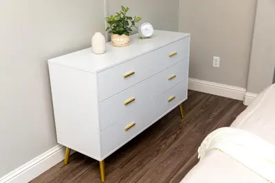 a white dresser with a plant on it in a bedroom at New Modern 3bed in North Merced 5 Star hosts in Merced