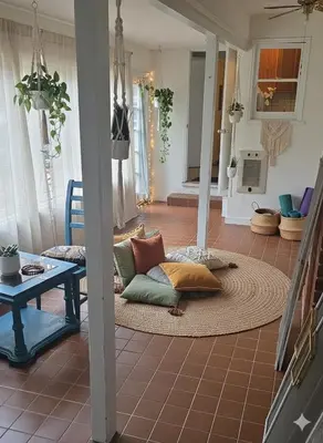 a living room with a couch and a table at 3BR 2B Boho Retreat with meditation room in Modesto