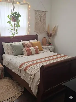 a bedroom with a large bed with pillows at 3BR 2B Boho Retreat with meditation room in Modesto