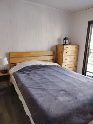 a bedroom with a large bed and a dresser at Tahoe Thunderbird Suite with Fireplace in South Lake Tahoe