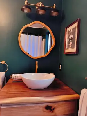 a bathroom with a large bowl sink and a mirror at Tahoe Thunderbird Suite with Fireplace in South Lake Tahoe
