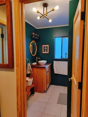 a bathroom with a sink and a mirror at Tahoe Thunderbird Suite with Fireplace in South Lake Tahoe