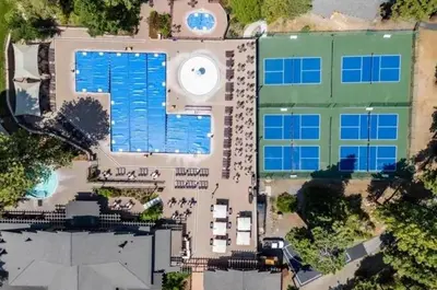 an overhead view of a large building with a pool at Northstar Studio near village and slopes in Truckee