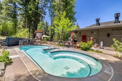 a swimming pool in front of a house at Northstar Studio near village and slopes in Truckee