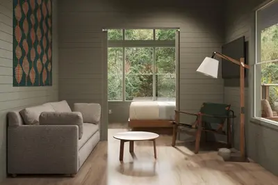 a living room with a couch and a bed at Outbound Yosemite in Oakhurst