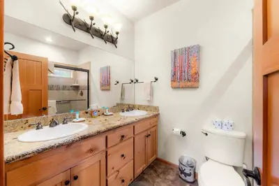 a bathroom with two sinks and a toilet at Lookout Point - Retreat for 6 in South Lake Tahoe