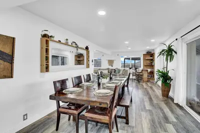 a dining room with a long table and chairs at Yosemite Retreat, Views and Hot Tub in Oakhurst