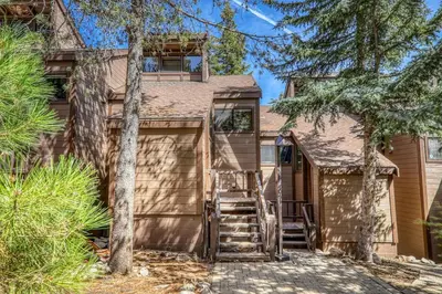 a house with stairs leading up to the front door at Newly Remodeled 2Bd 2Ba Condo in NorthStar in Truckee