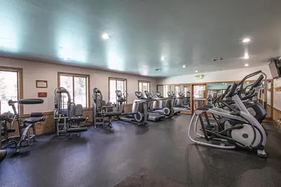a gym with several treadmills and machines in it at Newly Remodeled 2Bd 2Ba Condo in NorthStar in Truckee