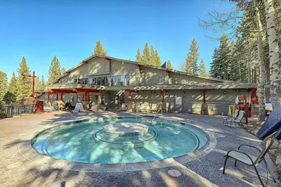 a large building with a fountain in front of it at Newly Remodeled 2Bd 2Ba Condo in NorthStar in Truckee