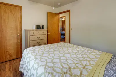a bedroom with a bed and a dresser at 5 Mi to Heavenly Resort Cozy Home with Fenced Yard in South Lake Tahoe