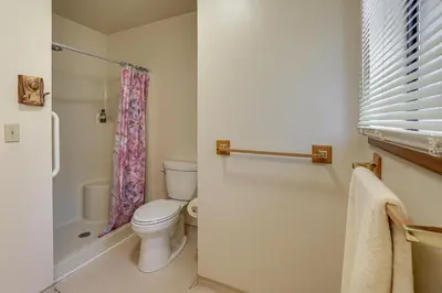 a bathroom with a toilet and a shower at 5 Mi to Heavenly Resort Cozy Home with Fenced Yard in South Lake Tahoe