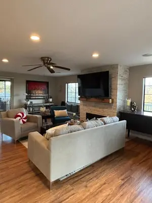 a living room with a couch and a tv at Canyon Ridge Retreat in Folsom