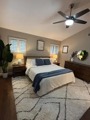a bedroom with a bed and a ceiling fan at Canyon Ridge Retreat in Folsom