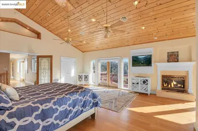 a bedroom with a bed and a fireplace at 7 br Mega home near Yosemite Spacious, Game Room in Groveland