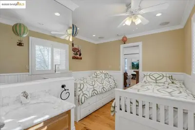 a large bathroom with a bed and a sink at 7 br Mega home near Yosemite Spacious, Game Room in Groveland