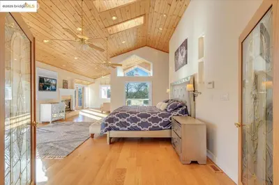 a bedroom with a bed and a wooden ceiling at 7 br Mega home near Yosemite Spacious, Game Room in Groveland