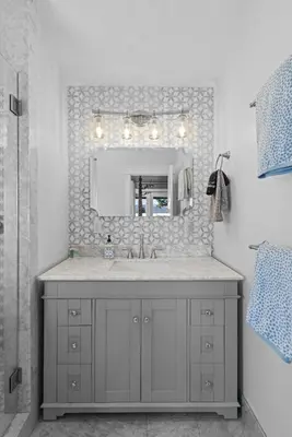 a bathroom with a sink and a mirror at Lakeview Luxury Retreat with Hot Tub and Game Room in Carnelian Bay