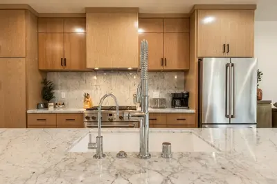 a kitchen with a sink and a faucet at Obsidian 104 in Mammoth Lakes