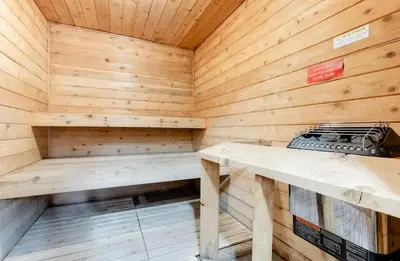 a wooden sauna with a bench in it at Summit 240 in Mammoth Lakes
