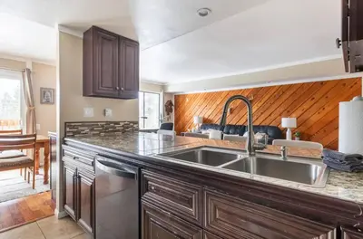 a kitchen with a sink and a counter top at Discovery Four 109 in Mammoth Lakes