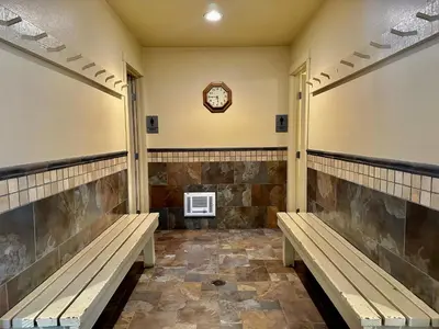 a waiting room with benches and a clock on the wall at Mammoth Estates 138 in Mammoth Lakes