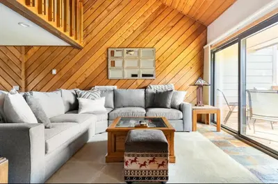 a living room with a couch and a table at Snowcreek 290 in Mammoth Lakes