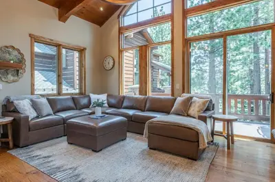 a living room with a brown leather couch and chairs at Stonegate 11 in Mammoth Lakes