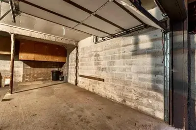 an empty garage with a brick wall at Bigwood 5 in Mammoth Lakes