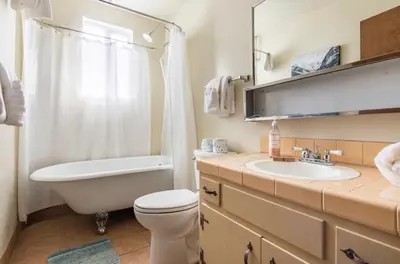 a bathroom with a tub and a toilet and a sink at Mammoth View Villas 20 in Mammoth Lakes