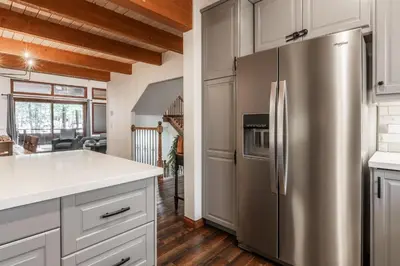 a kitchen with a stainless steel refrigerator at Winterset 20 in Mammoth Lakes