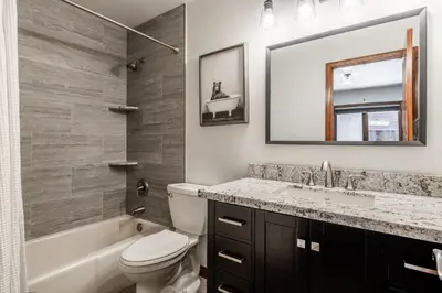 a bathroom with a sink toilet and a mirror at Winterset 20 in Mammoth Lakes