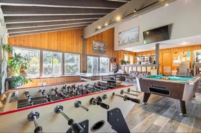 a large room with a pool table and a pool table at Seasons Four 193 in Mammoth Lakes