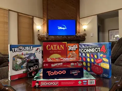 a pile of snacks on a table with a tv on top at Aspen Creek 219 in Mammoth Lakes