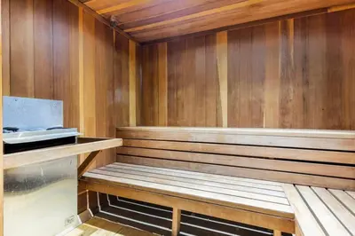 a sauna with wooden walls and a wooden bench at Aspen Creek 219 in Mammoth Lakes