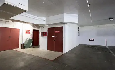 an empty room with two doors in a building at Aspen Creek 219 in Mammoth Lakes