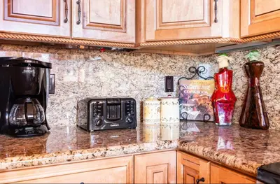 a kitchen counter with a coffee maker and a microwave at Mammoth Ski and Racquet 89 in Mammoth Lakes